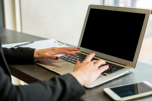 brunette-businesswoman-using-laptop